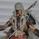 Illustration for article titled Im Playing emAssassins Creed IV/em Right Now. On My Desk. With Toys.